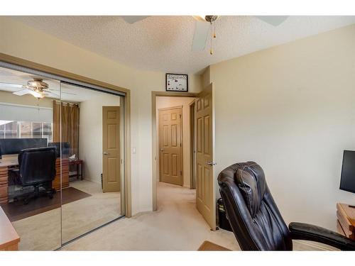 38 Crystal Shores Heights, Okotoks, AB - Indoor Photo Showing Office