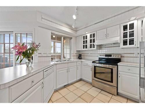 95 Millbank Hill Sw, Calgary, AB - Indoor Photo Showing Kitchen With Double Sink