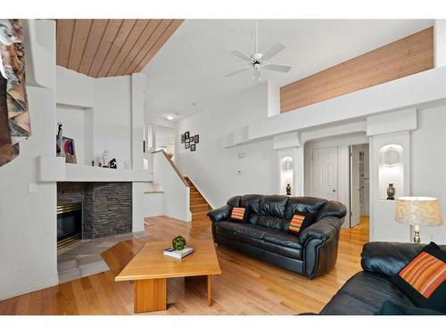 95 Millbank Hill Sw, Calgary, AB - Indoor Photo Showing Living Room With Fireplace