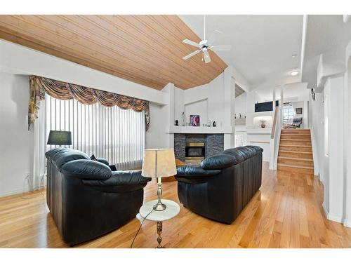 95 Millbank Hill Sw, Calgary, AB - Indoor Photo Showing Living Room With Fireplace