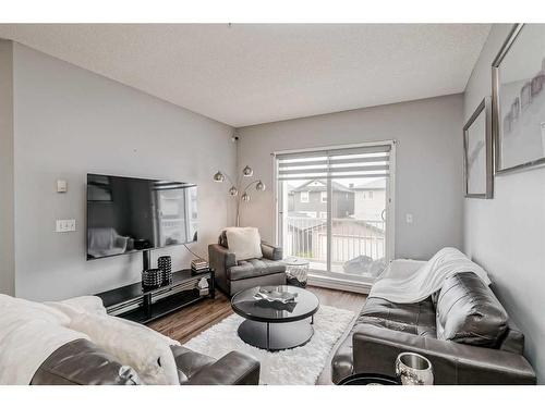 1214-1140 Taradale Drive Ne, Calgary, AB - Indoor Photo Showing Living Room