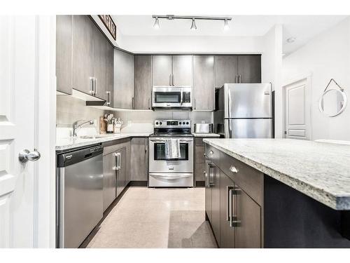 147 Cranford Walk Se, Calgary, AB - Indoor Photo Showing Kitchen With Upgraded Kitchen