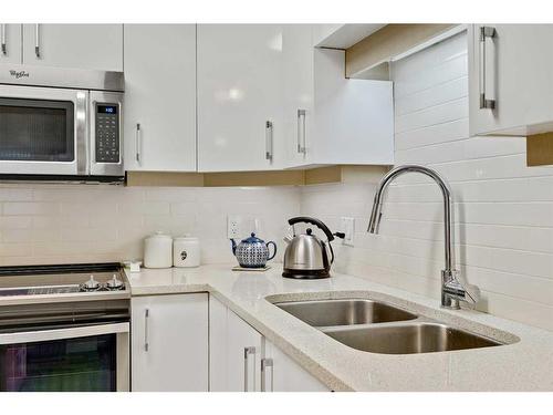 210-804 3 Avenue Sw, Calgary, AB - Indoor Photo Showing Kitchen With Double Sink