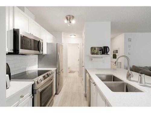 119-260 Shawville Way Se, Calgary, AB - Indoor Photo Showing Kitchen With Stainless Steel Kitchen With Double Sink With Upgraded Kitchen