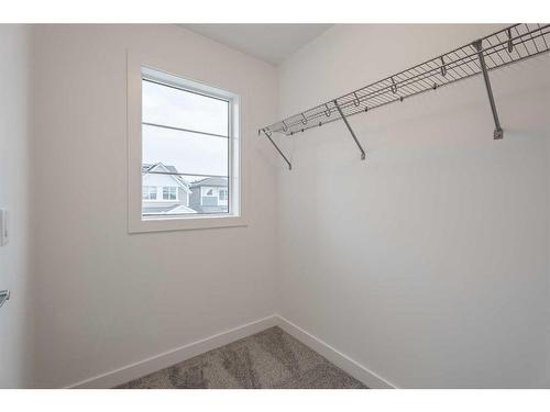 37 Amblefield Passage Nw, Calgary, AB - Indoor With Storage