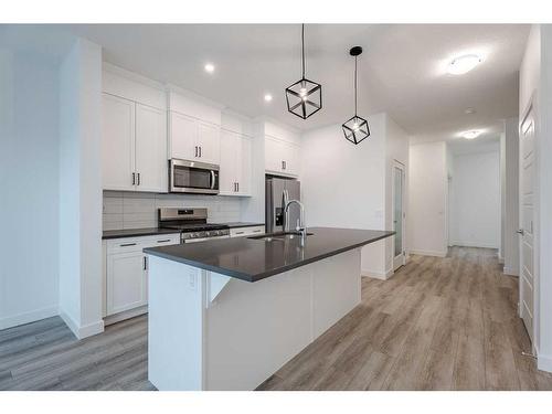 37 Amblefield Passage Nw, Calgary, AB - Indoor Photo Showing Kitchen With Stainless Steel Kitchen With Upgraded Kitchen