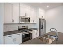 37 Amblefield Passage Nw, Calgary, AB  - Indoor Photo Showing Kitchen With Stainless Steel Kitchen With Double Sink With Upgraded Kitchen 