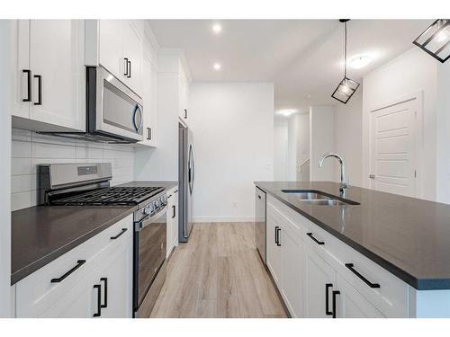 37 Amblefield Passage Nw, Calgary, AB - Indoor Photo Showing Kitchen With Double Sink With Upgraded Kitchen