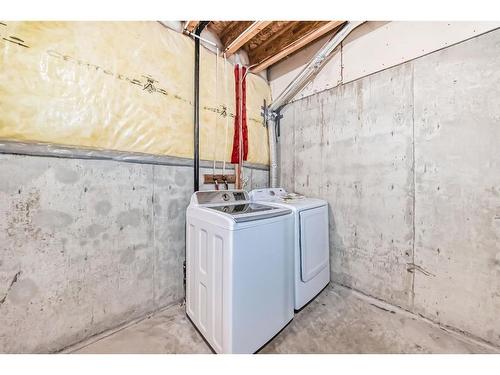 355 Eversyde Boulevard Sw, Calgary, AB - Indoor Photo Showing Laundry Room