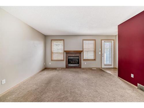 355 Eversyde Boulevard Sw, Calgary, AB - Indoor With Fireplace