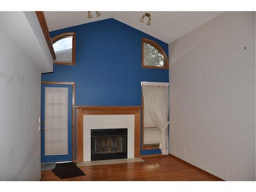 162 Oakbriar Close Sw, Calgary, AB - Indoor With Fireplace
