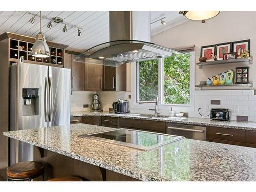 687 Cedarille Way Sw, Calgary, AB - Indoor Photo Showing Kitchen With Double Sink With Upgraded Kitchen