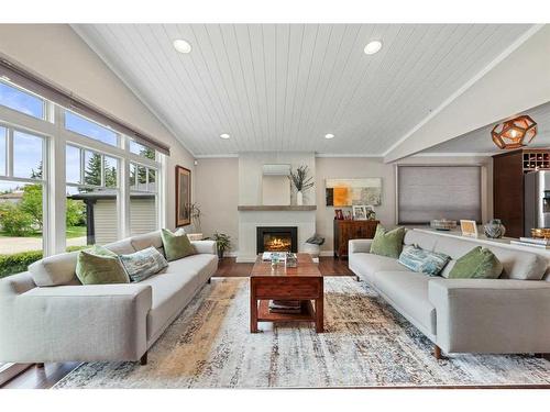 687 Cedarille Way Sw, Calgary, AB - Indoor Photo Showing Living Room With Fireplace