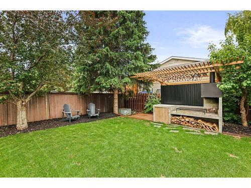 687 Cedarille Way Sw, Calgary, AB - Outdoor With Backyard