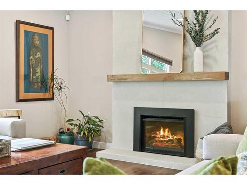 687 Cedarille Way Sw, Calgary, AB - Indoor Photo Showing Living Room With Fireplace