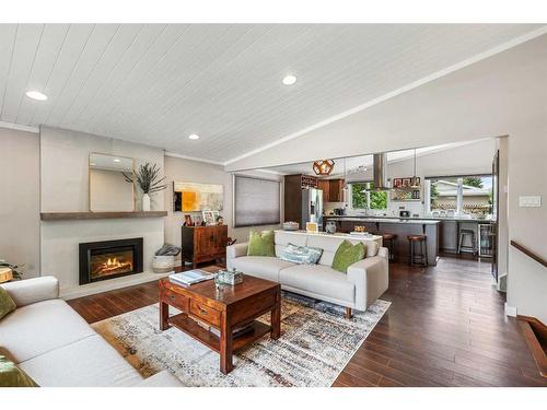 687 Cedarille Way Sw, Calgary, AB - Indoor Photo Showing Living Room With Fireplace