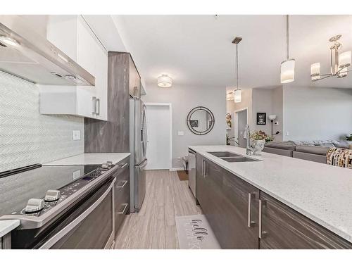 507-2231 Mahogany Boulevard Se, Calgary, AB - Indoor Photo Showing Kitchen With Double Sink With Upgraded Kitchen