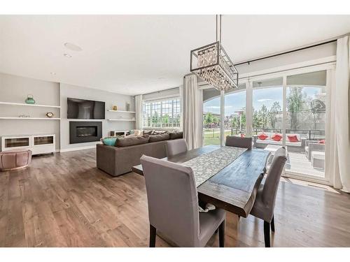 108 Masters Court Se, Calgary, AB - Indoor Photo Showing Dining Room With Fireplace