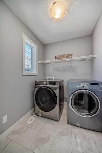 108 Masters Court Se, Calgary, AB - Indoor Photo Showing Laundry Room