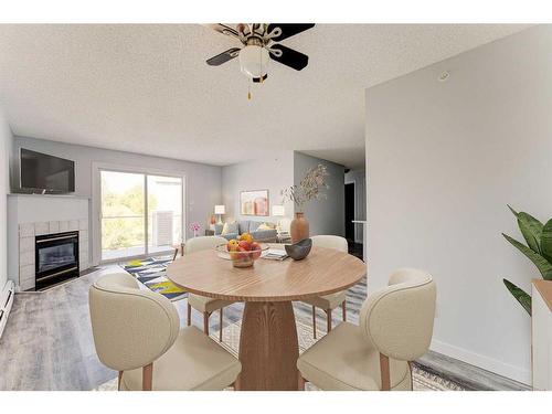 403-6000 Somervale Court Sw, Calgary, AB - Indoor With Fireplace