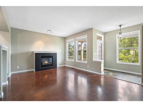 1343 New Brighton Park Se, Calgary, AB - Indoor Photo Showing Living Room With Fireplace