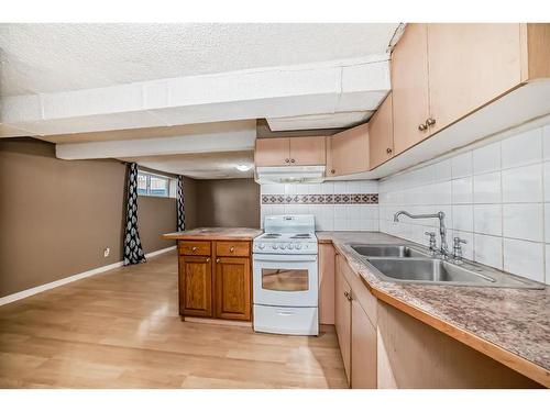 898 Rundlecairn Way Ne, Calgary, AB - Indoor Photo Showing Kitchen With Double Sink