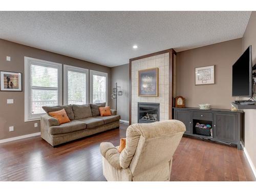 144 Mahogany Terrace Se, Calgary, AB - Indoor Photo Showing Living Room With Fireplace