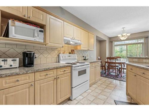 10 Cranston Drive Se, Calgary, AB - Indoor Photo Showing Kitchen