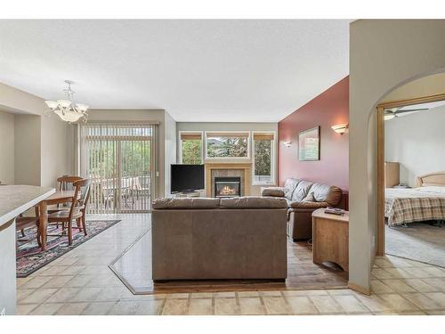 10 Cranston Drive Se, Calgary, AB - Indoor Photo Showing Living Room With Fireplace