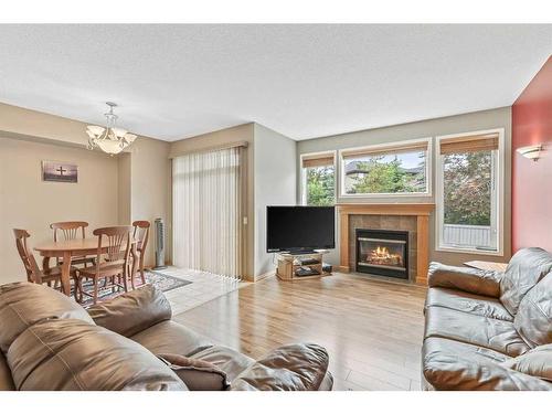 10 Cranston Drive Se, Calgary, AB - Indoor Photo Showing Living Room With Fireplace