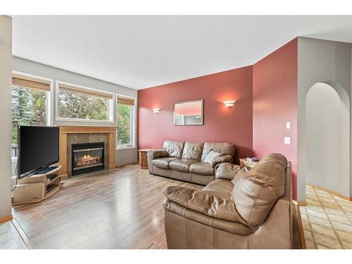10 Cranston Drive Se, Calgary, AB - Indoor Photo Showing Living Room With Fireplace