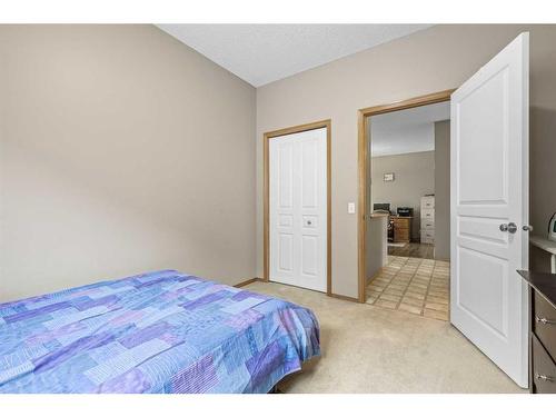 10 Cranston Drive Se, Calgary, AB - Indoor Photo Showing Bedroom