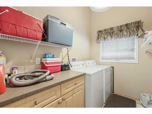 10 Cranston Drive Se, Calgary, AB - Indoor Photo Showing Laundry Room