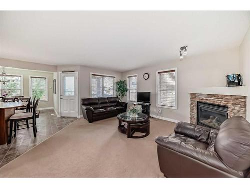 274 Covecreek Close Ne, Calgary, AB - Indoor Photo Showing Living Room With Fireplace