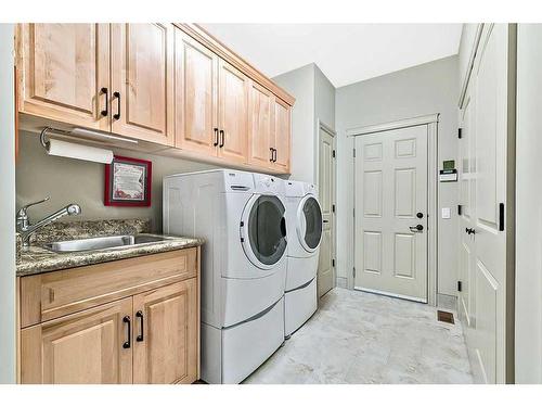 158 Cimarron Drive, Okotoks, AB - Indoor Photo Showing Laundry Room