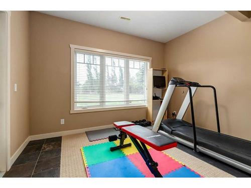 79 Lynx Meadows Drive Nw, Calgary, AB - Indoor Photo Showing Gym Room