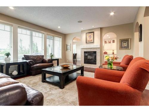 79 Lynx Meadows Drive Nw, Calgary, AB - Indoor Photo Showing Living Room With Fireplace