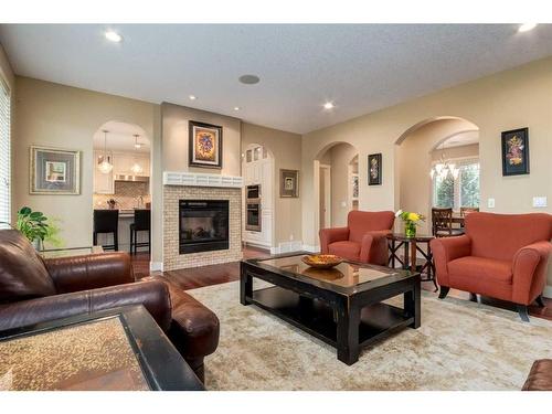 79 Lynx Meadows Drive Nw, Calgary, AB - Indoor Photo Showing Living Room With Fireplace
