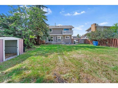 52 Woodmont Drive Sw, Calgary, AB - Outdoor With Backyard