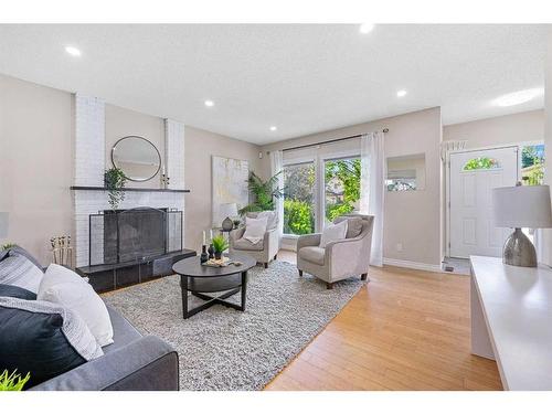 52 Woodmont Drive Sw, Calgary, AB - Indoor Photo Showing Living Room With Fireplace