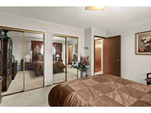 124 Oakhampton Place Sw, Calgary, AB - Indoor Photo Showing Bedroom