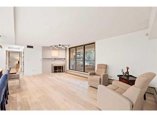 405-1215 Cameron Avenue Sw, Calgary, AB - Indoor Photo Showing Living Room With Fireplace