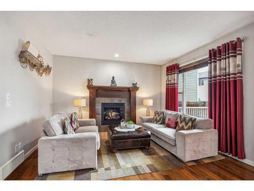 1034 Brightoncrest Common Se, Calgary, AB - Indoor Photo Showing Living Room With Fireplace