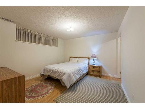 15 Patterson Drive Sw, Calgary, AB - Indoor Photo Showing Bedroom