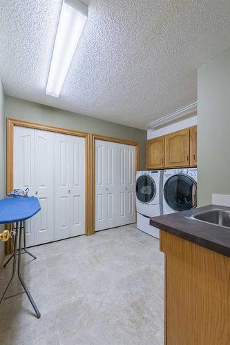 15 Patterson Drive Sw, Calgary, AB - Indoor Photo Showing Laundry Room