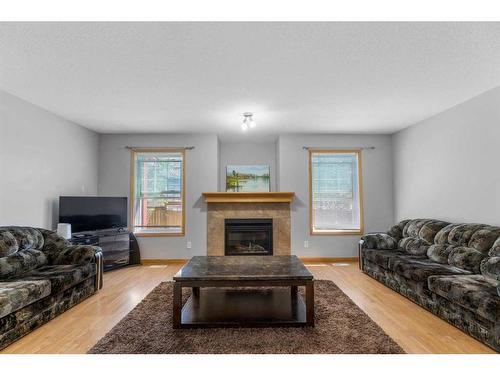 35 Saddleland Drive Ne, Calgary, AB - Indoor Photo Showing Living Room With Fireplace