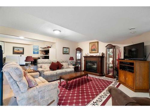 30306 Woodland Heights, Rural Rocky View County, AB - Indoor Photo Showing Living Room With Fireplace