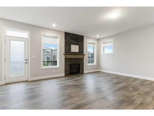 36 Carrington Close Nw, Calgary, AB - Indoor Photo Showing Living Room With Fireplace