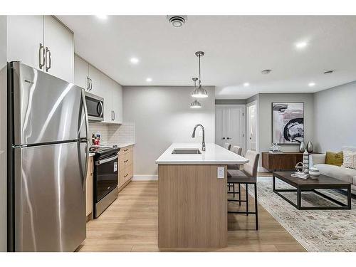 339 Hendon Drive Nw, Calgary, AB - Indoor Photo Showing Kitchen With Upgraded Kitchen