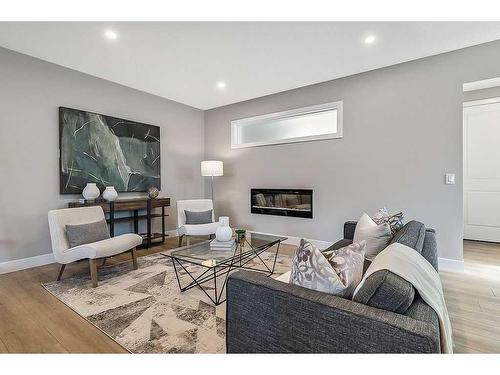 339 Hendon Drive Nw, Calgary, AB - Indoor Photo Showing Living Room With Fireplace